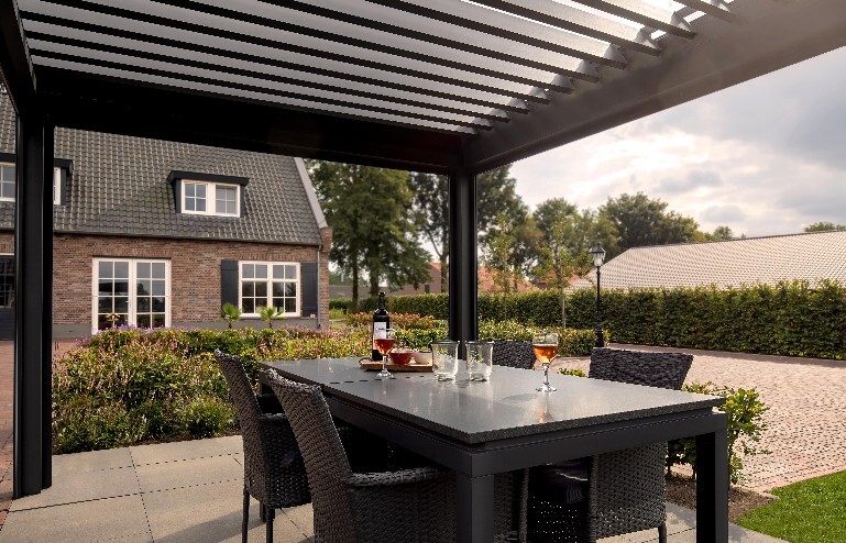 Bioclimatic pergola over dining table