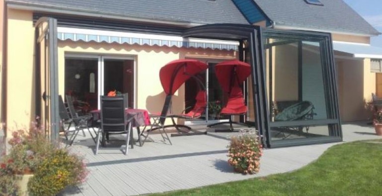 Home with sliding terrace canopy